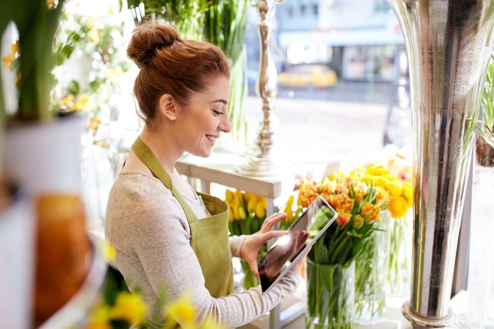A photo of Flower Shop Owner doing the books A photo of Flower Shop Owner doing the books