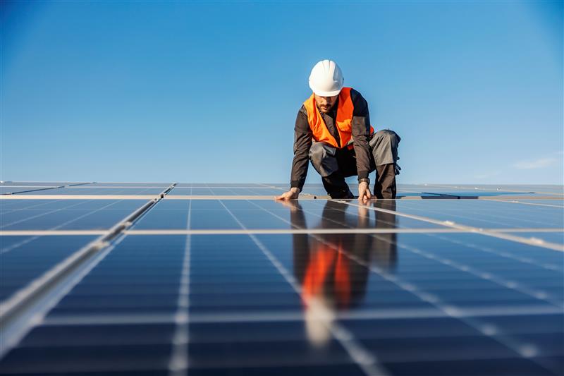 A photo of crew working on solar panel