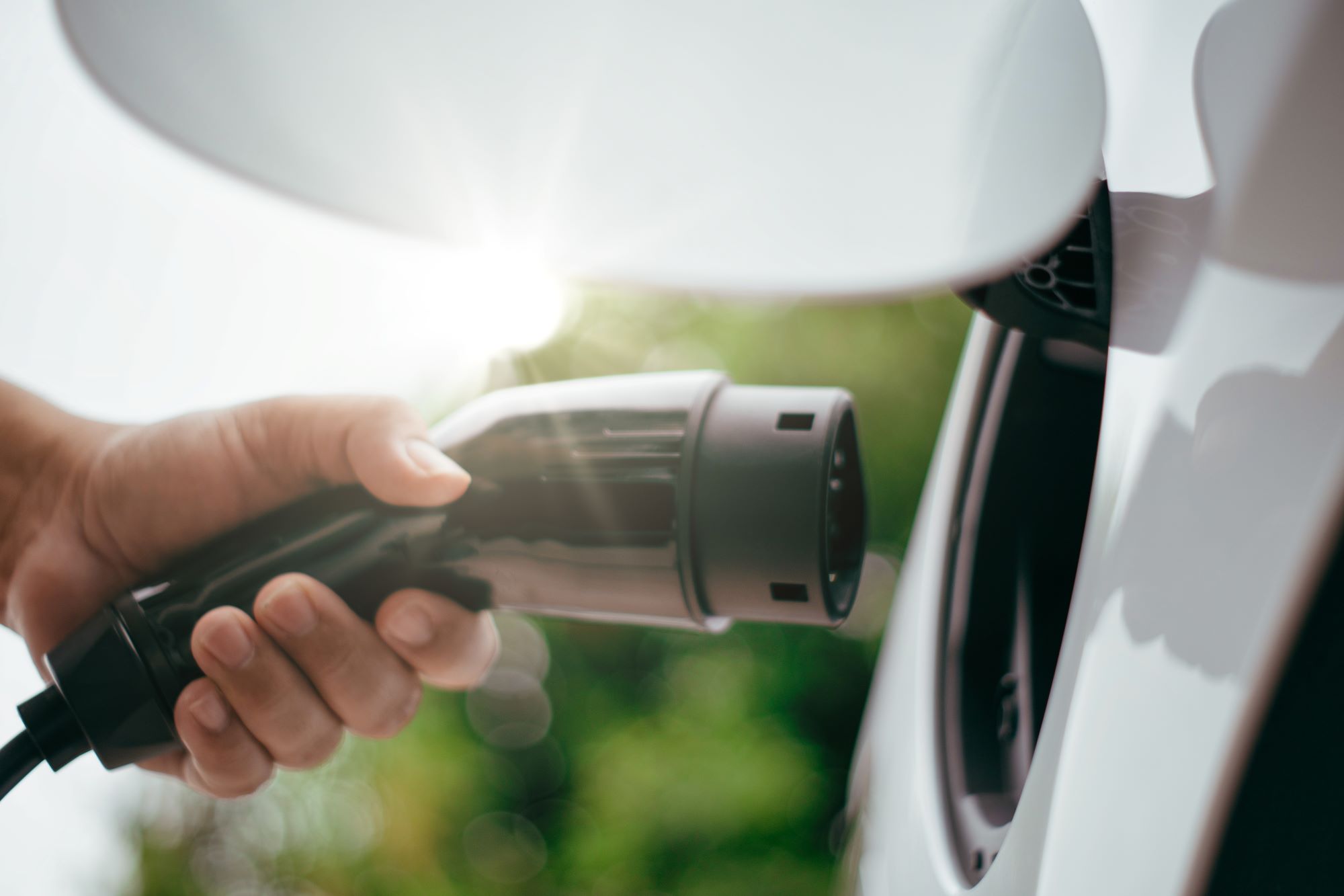 A photo of EV Charging plug and EV Charger